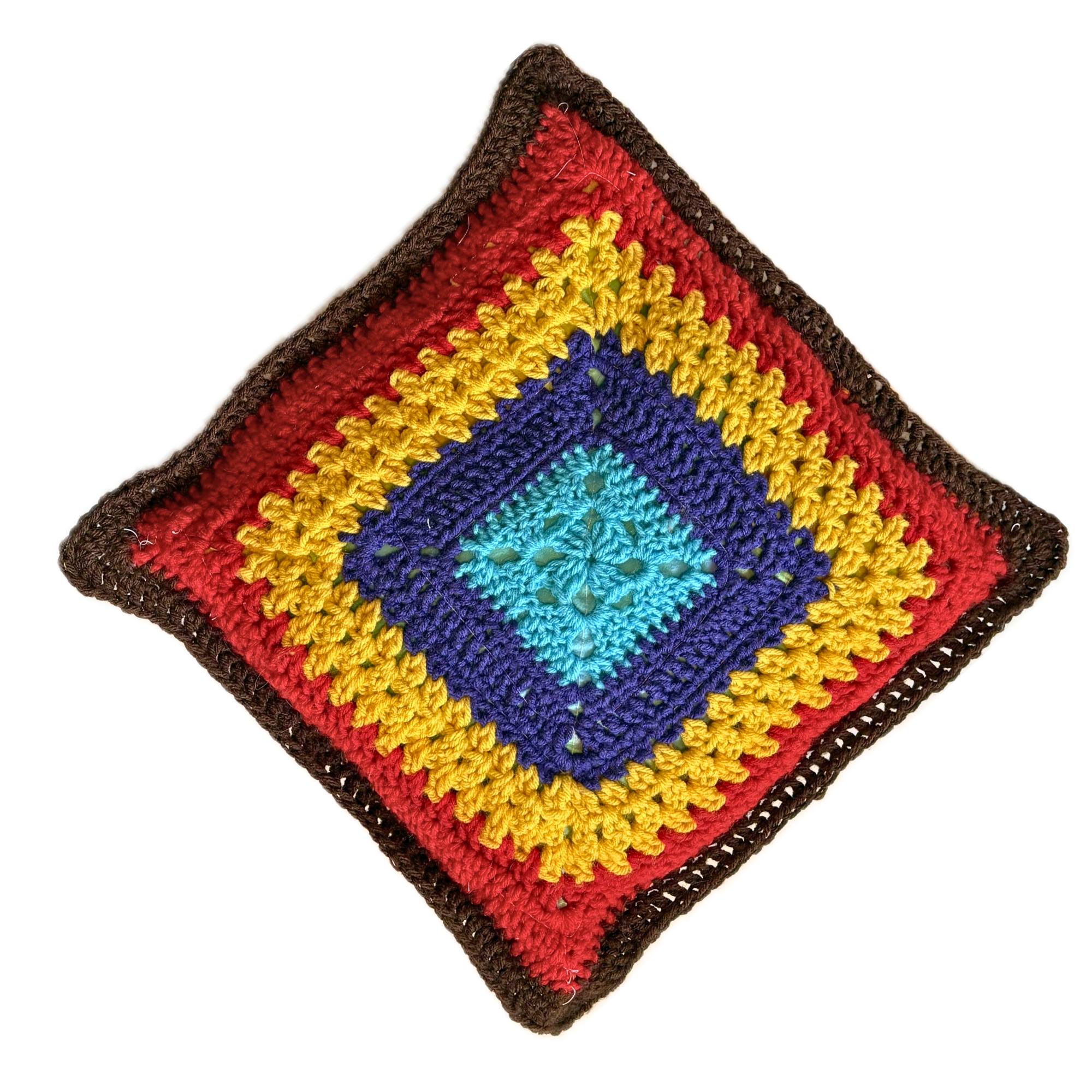 Colorful crocheted square pillow with a diamond pattern on a white background