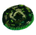 Green and black crocheted hat on a white background