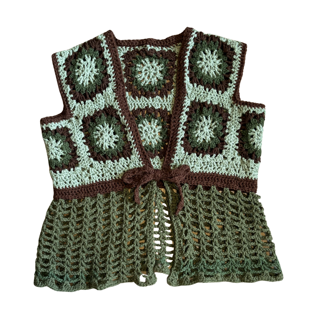 Crocheted vest with a pattern of green and brown squares on a white background