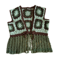 Crocheted vest with a pattern of green and brown squares on a white background