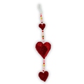 Decorative heart ornament with beads on a white background