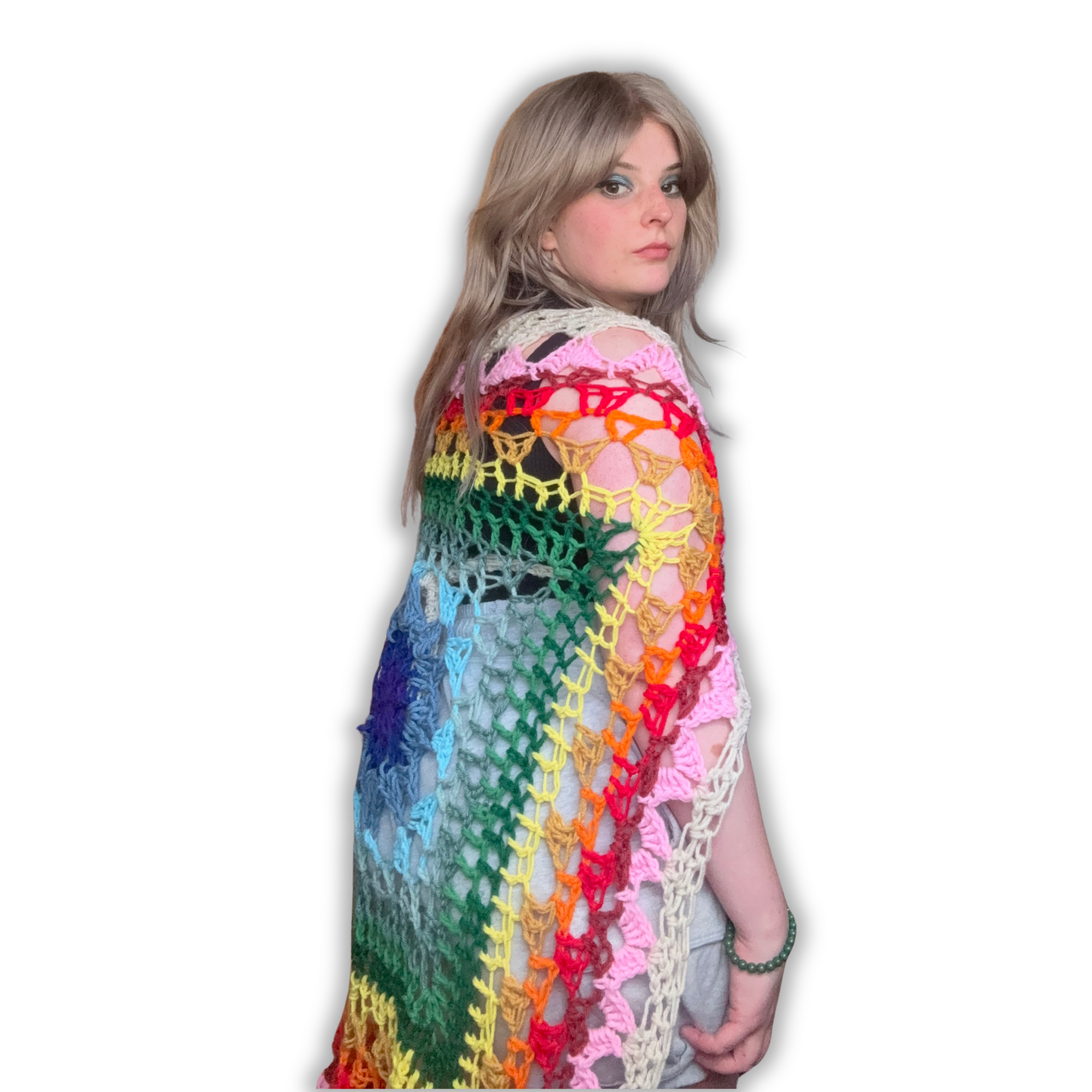 Woman wearing a colorful crocheted shawl on a white background